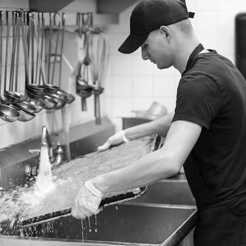 Dishwasher staff is restocking rental items